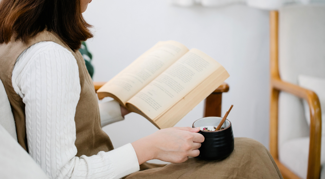 A lady reading the book