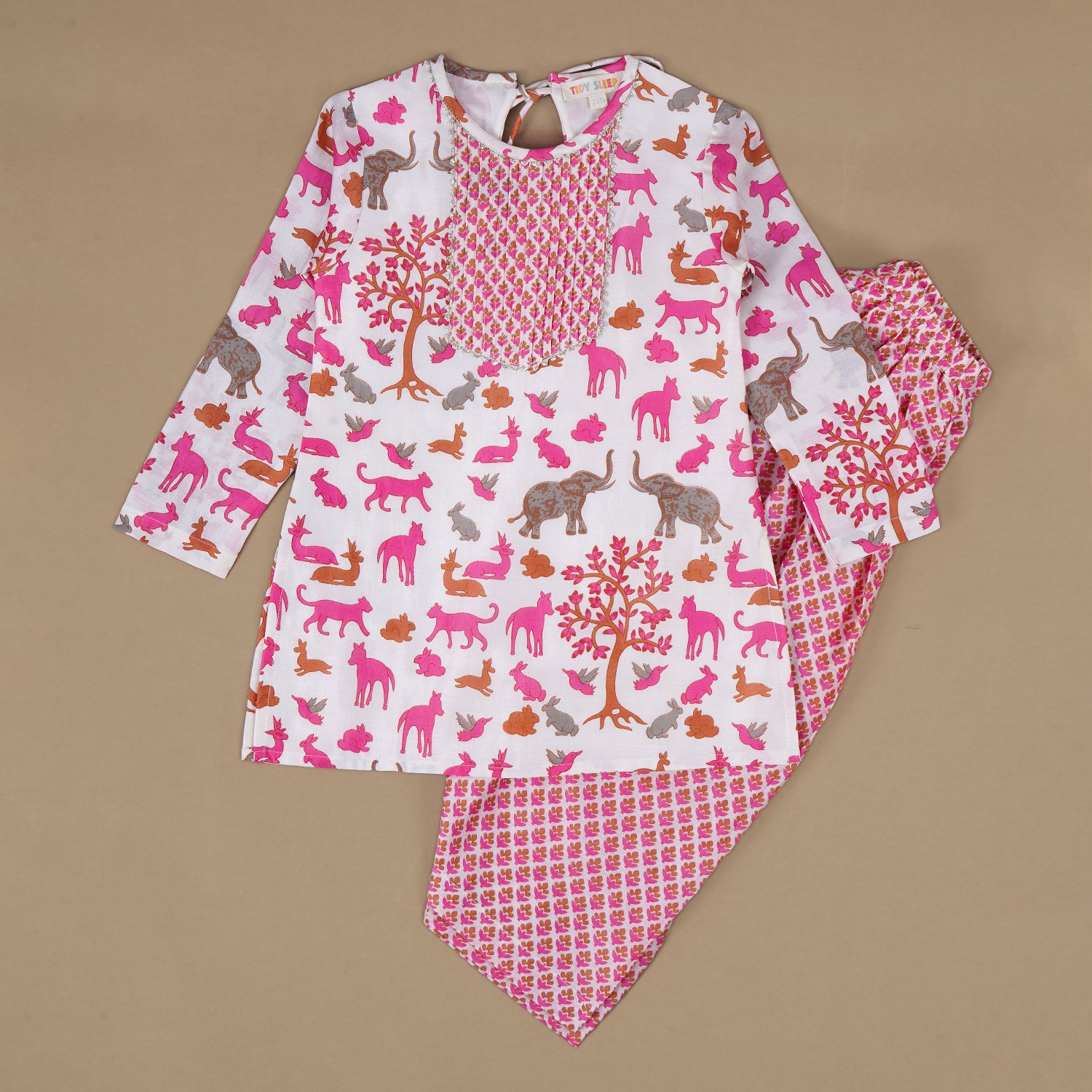 A pink kurta set for a  baby girl matching with pink salwar, kurta has a round neckline with pleated detailing, colorful print of various animals like elephants, rabbits, cats, and birds.