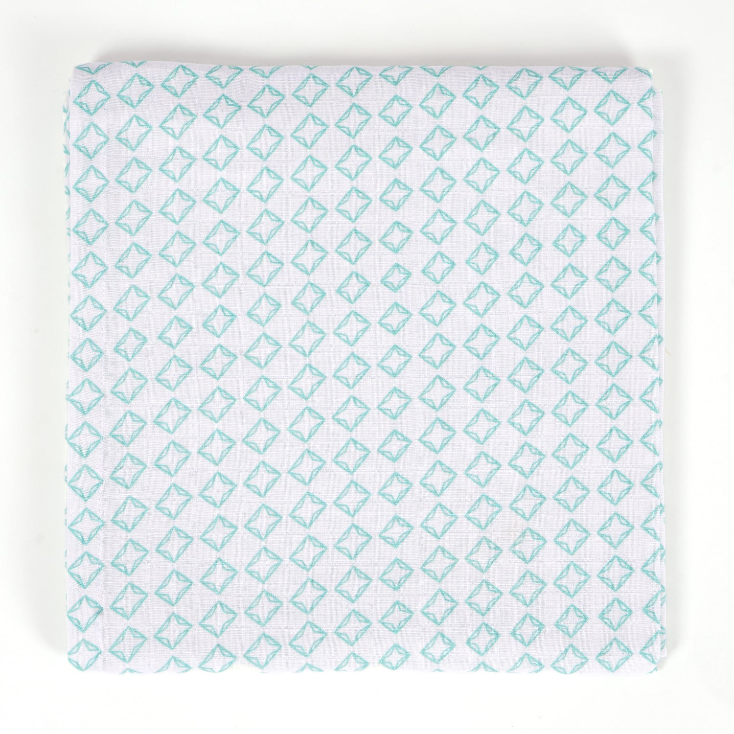 Baby changing mat with a teal geometric diamond pattern.