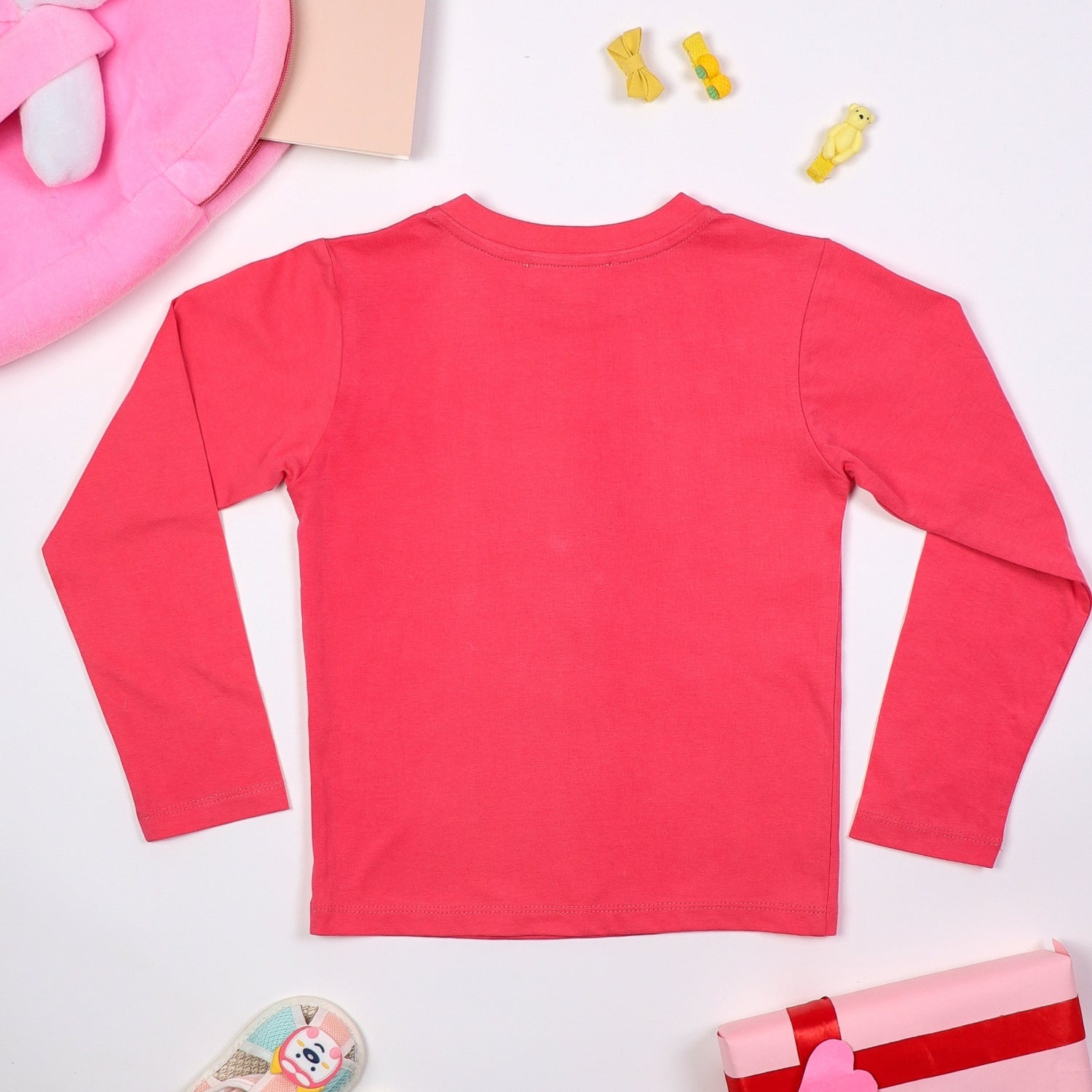 Back view of pink long-sleeve baby top with a cute bunny and flower print